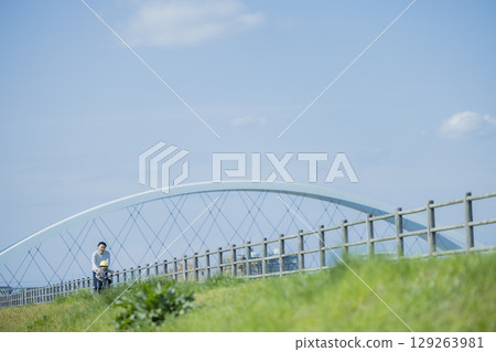 Children riding a bicycle 129263981