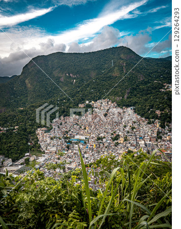 Aerial View Of Rocinha Favela In Rio De Janeiro: Dense Urban Landscape With Colorful Rooftops And Narrow Streets In The Largest Informal Settlement In Brazil 129264293