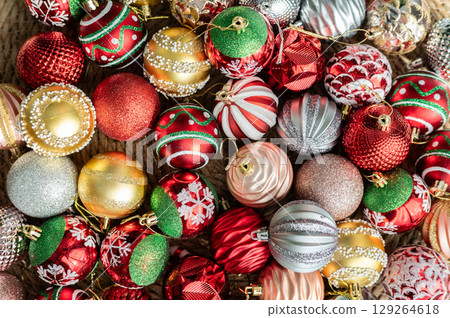 Group of Christmas ornaments prepare for decorative to a Christmas tree. Hanging religious ornaments on a tree was a way to honor the true meaning of Christmas, Jesus Christ's birth. 129264618