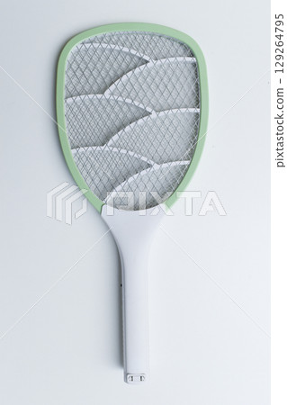 green mosquito swatter isolated on white background 129264795