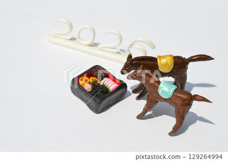 Paper clay horse and New Year's dishes Paper clay horse and New Year's dishes 129264994