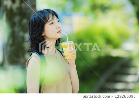 A woman walking in green 129266395