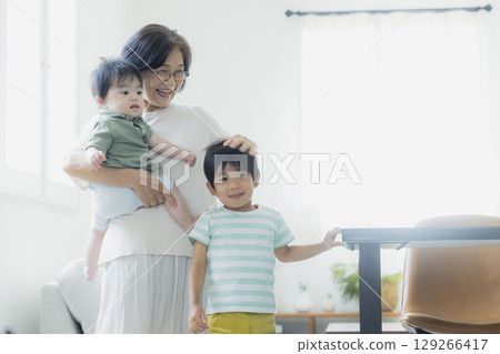 Baby being held by grandma Baby being held by grandma 129266417