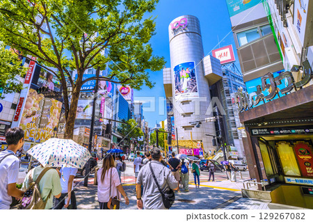Tokyo cityscape, Japan, August 5th. Inbound tourism continues... Shibuya is bustling with foreign tourists even though it's before noon. On the right is Shibuya Station. 129267082