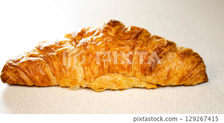 Croissant on White Background Fresh and Flaky Pastry Croissant on White Background Fresh and Flaky Pastry 129267415