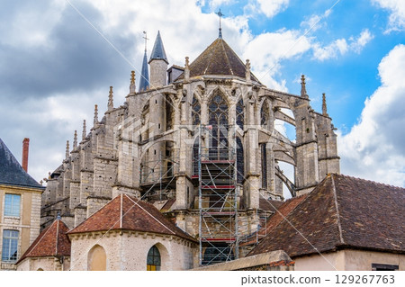 Auxerre Cathedral, France A Gothic Architectural Marvel Under a Cloudy Blue Sky 129267763