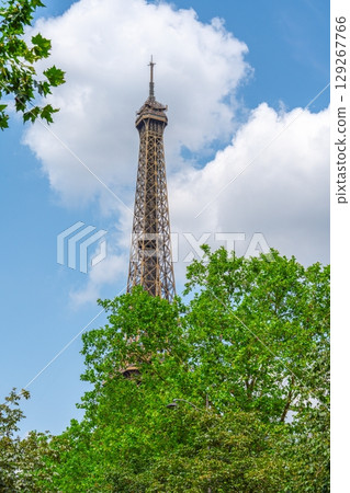 Iconic landmark in Paris, France, with blue sky and foliage, ideal for travel and tourism 129267766