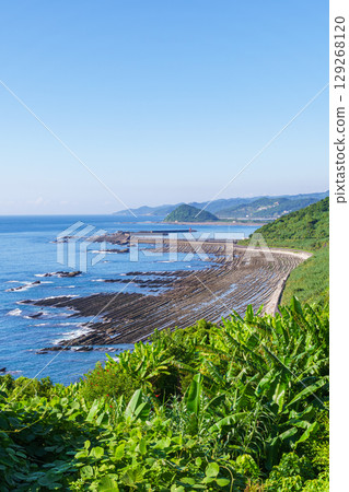 Oni no Sentakuiwa Rocks as seen from the Phoenix Roadside Station on Miyazaki Prefecture's Nichinan Coast 129268120