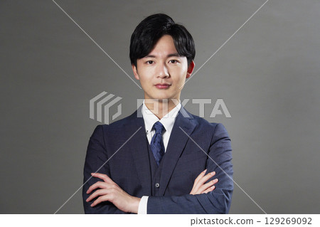 Businessman portrait black background looking at camera 129269092