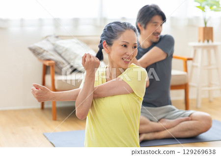 Male and female stretching Male and female stretching 129269638