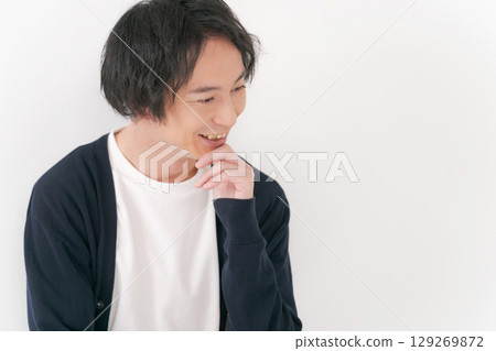 Smiling man in plain clothes 129269872