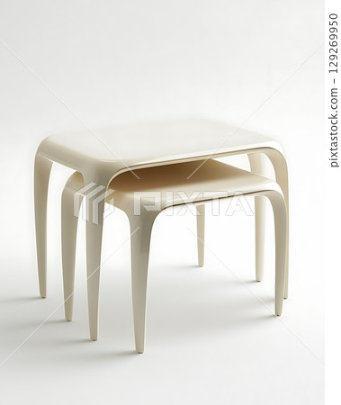White table with three legs and a white top 129269950