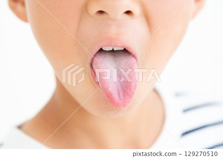 Elementary school boy's tongue 129270510