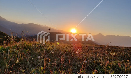 A breathtaking sunset in the majestic mountains of the Caucasus. A breathtaking sunset in the majestic mountains of the Caucasus. 129270627