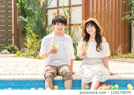 Couples playing by the pool at a resort hotel on vacation 129270676