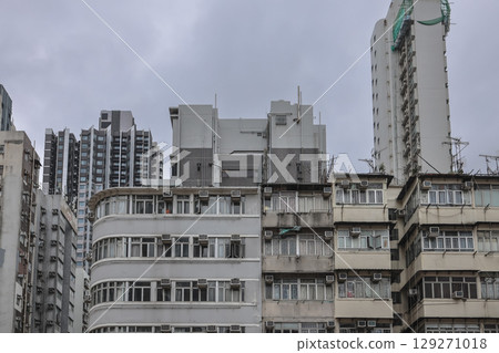 Aug 3 2025 Urban Apartment Building Exterior with Numerous Windows 129271018