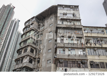 Aug 3 2025 Urban Apartment Building Exterior with Numerous Windows 129271026
