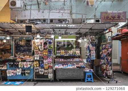 Aug 3 2025 Market Stall Displaying Varied Slippers and Footwear for Sale 129271068