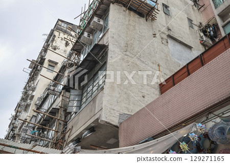 Aug 3 2025 Urban Apartment Building Exterior with Numerous Windows 129271165