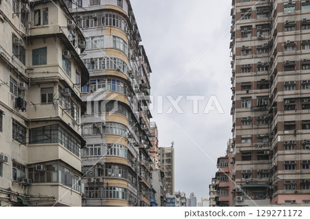 Aug 3 2025 Urban Apartment Building Exterior with Numerous Windows 129271172