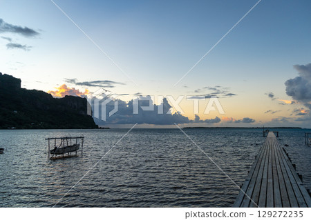 Sunset over the tranquil lagoon of Maupiti, French Polynesia Sunset over the tranquil lagoon of Maupiti, French Polynesia 129272235