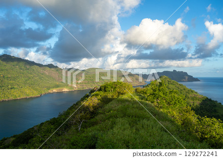 Sunset over Taipivai Bay in Nuku Hiva, French Polynesia Sunset over Taipivai Bay in Nuku Hiva, French Polynesia 129272241
