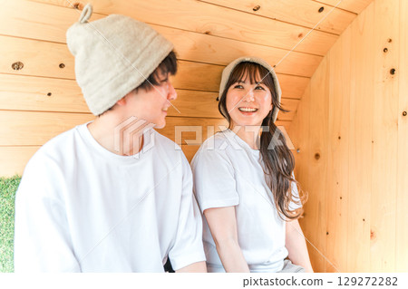 A young couple wearing T-shirts in a sauna A young couple wearing T-shirts in a sauna 129272282