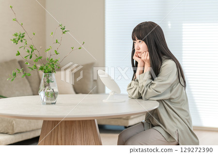 Young Asian woman getting angry while looking in the mirror because of rough skin and skin problems (acne, dermatitis, dry skin, sensitive skin) Young Asian woman getting angry while looking in the mirror because of rough skin and skin problems (acne, dermatitis, dry skin, sensitive skin) 129272390