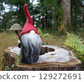 Tomte on a stump 129272691
