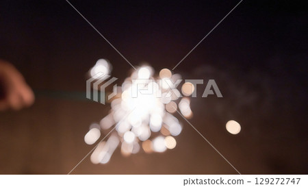 Handheld fireworks image soft focus 129272747