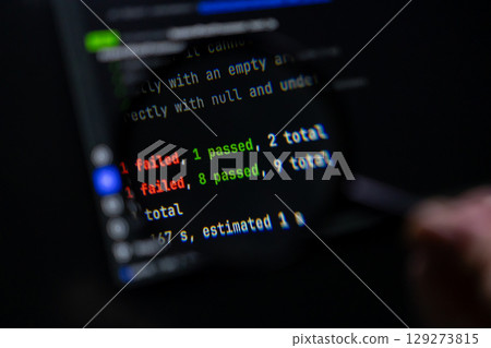 Dark computer screen displays programming test results showing 'failed' and 'passed' counts, symbolizing software development, debugging, and quality assurance 129273815