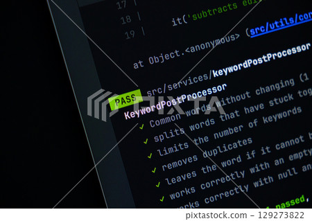 Digital display of programming code shows PASS for KeywordPostProcessor, representing successful software development, testing, and quality assurance 129273822