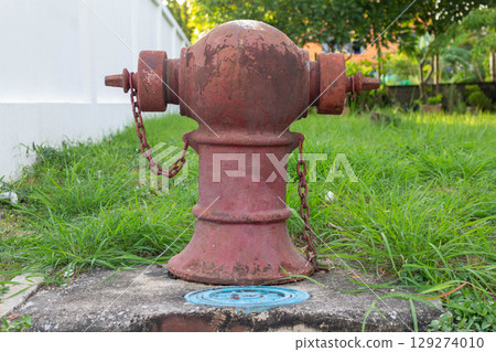 Red Fire Hydrant by the Road in a Village Red Fire Hydrant by the Road in a Village 129274010