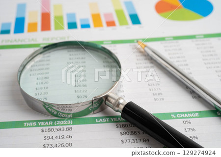 Magnifying glass on charts graphs paper. Financial development, Banking Account, Statistic, Investment Analytic research data economy. Magnifying glass on charts graphs paper. Financial development, Banking Account, Statistic, Investment Analytic research data economy. 129274924