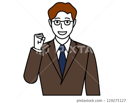 A man wearing glasses and a brown suit clenching his fist. 129275127