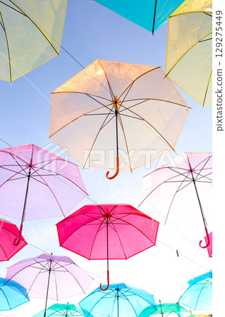 A colorful umbrella sky covers the evening sky on a sunny summer day. A colorful umbrella sky covers the evening sky on a sunny summer day. 129275449