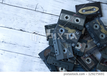Piles of cassette tapes 129275691
