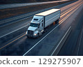 American long-nose semitruck on a highway 129275907