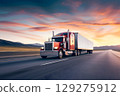 Classic American long-nose semitruck on a highway 129275912