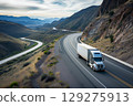 American long-nose semitruck on a highway 129275913
