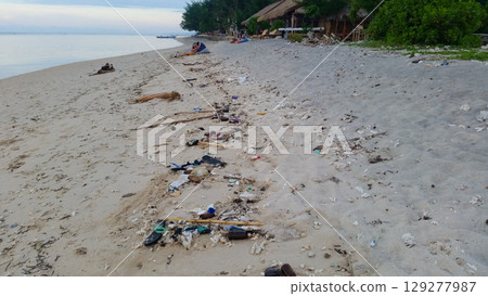 a lot of garbage on the sandy sea beach a lot of garbage on the sandy sea beach 129277987