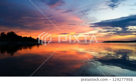 beautiful dramatic landscape of sunset on the sea beach 129277988