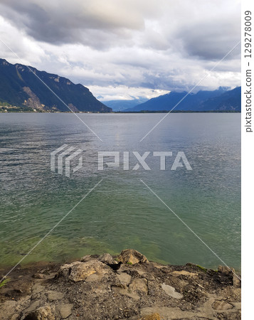 beautiful seascape on the horizon silhouette of mountains 129278009