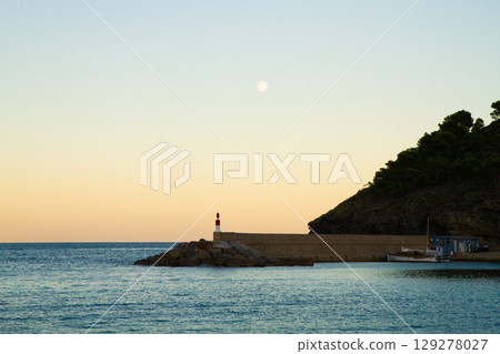 beautiful landscape of sea lighthouse at sunset 129278027