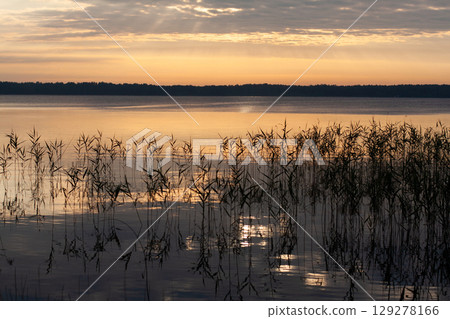 beautiful and picturesque sunset landscape on the lake beautiful and picturesque sunset landscape on the lake 129278166