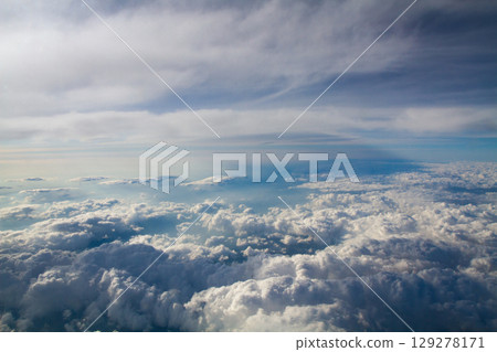 beautiful thick clouds in the sky from the height of the plane 129278171