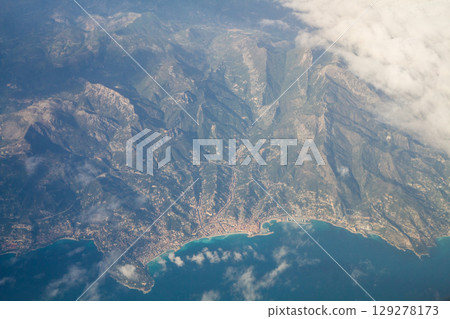 beautiful thick clouds in the sky from the height of the flight of the plane with a view of the continent and countries beautiful thick clouds in the sky from the height of the flight of the plane with a view of the continent and countries 129278173