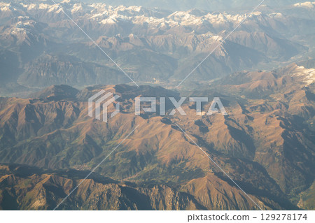 beautiful mountain landscape on high rocks from the height of the flight of the plane 129278174