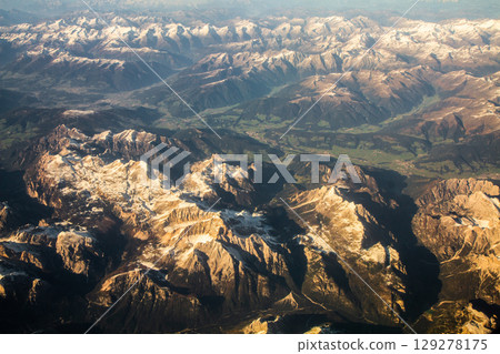 beautiful mountain landscape on high rocks from the height of the flight of the plane 129278175