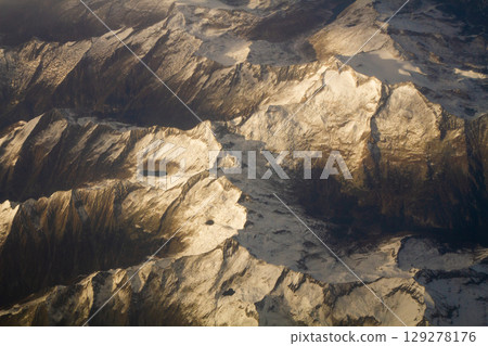 beautiful mountain landscape on high rocks from the height of the flight of the plane 129278176